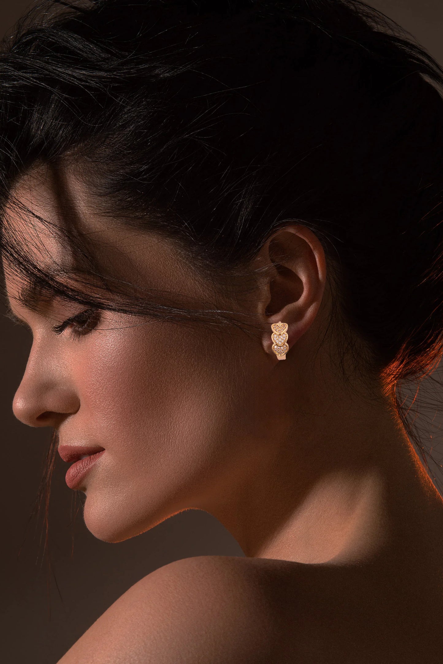 Elegant Gold-Tone Triple Heart Stud Earrings with Crystal Detailing - Amulya Gems