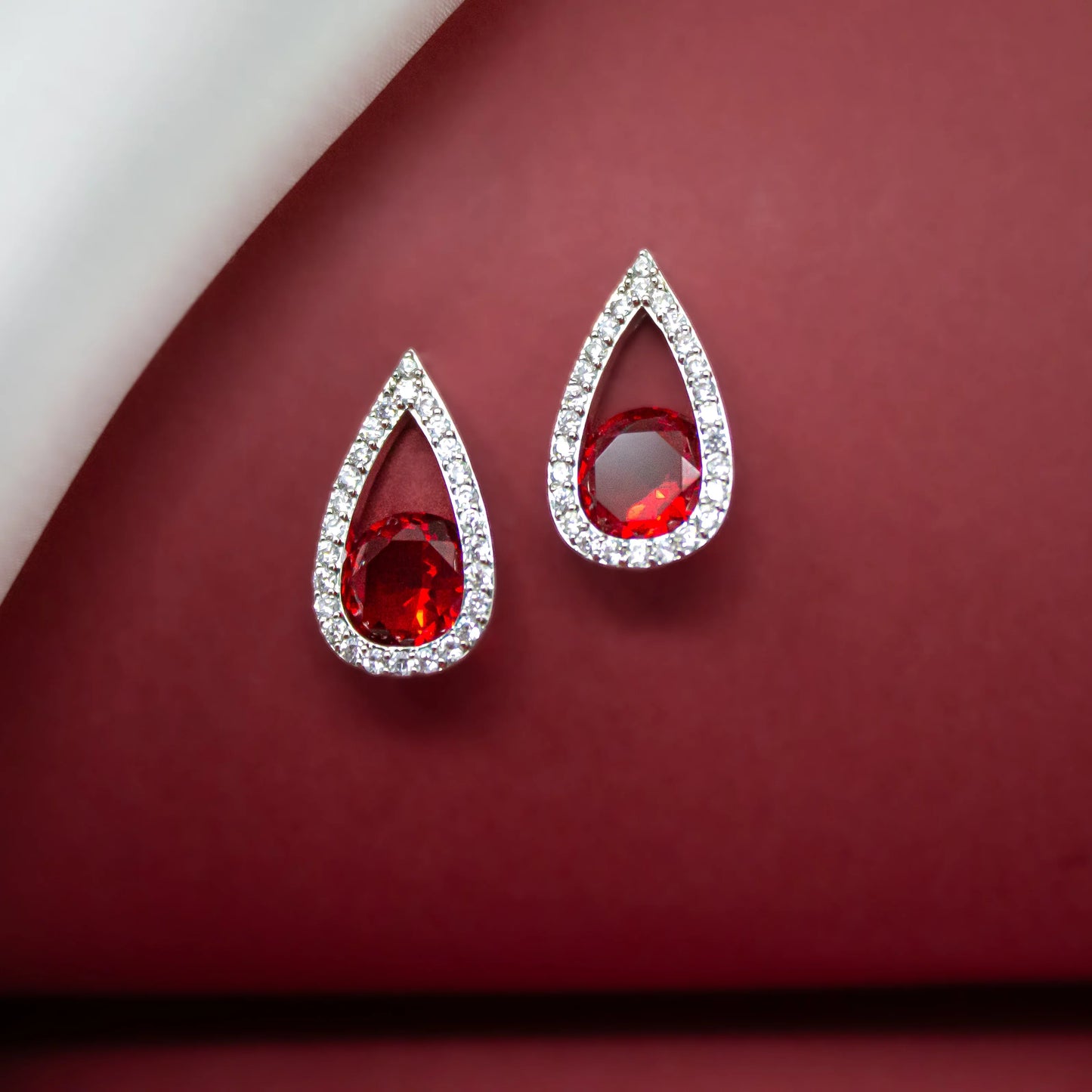 Red Dazzles Stud Earrings - Amulya Gems
