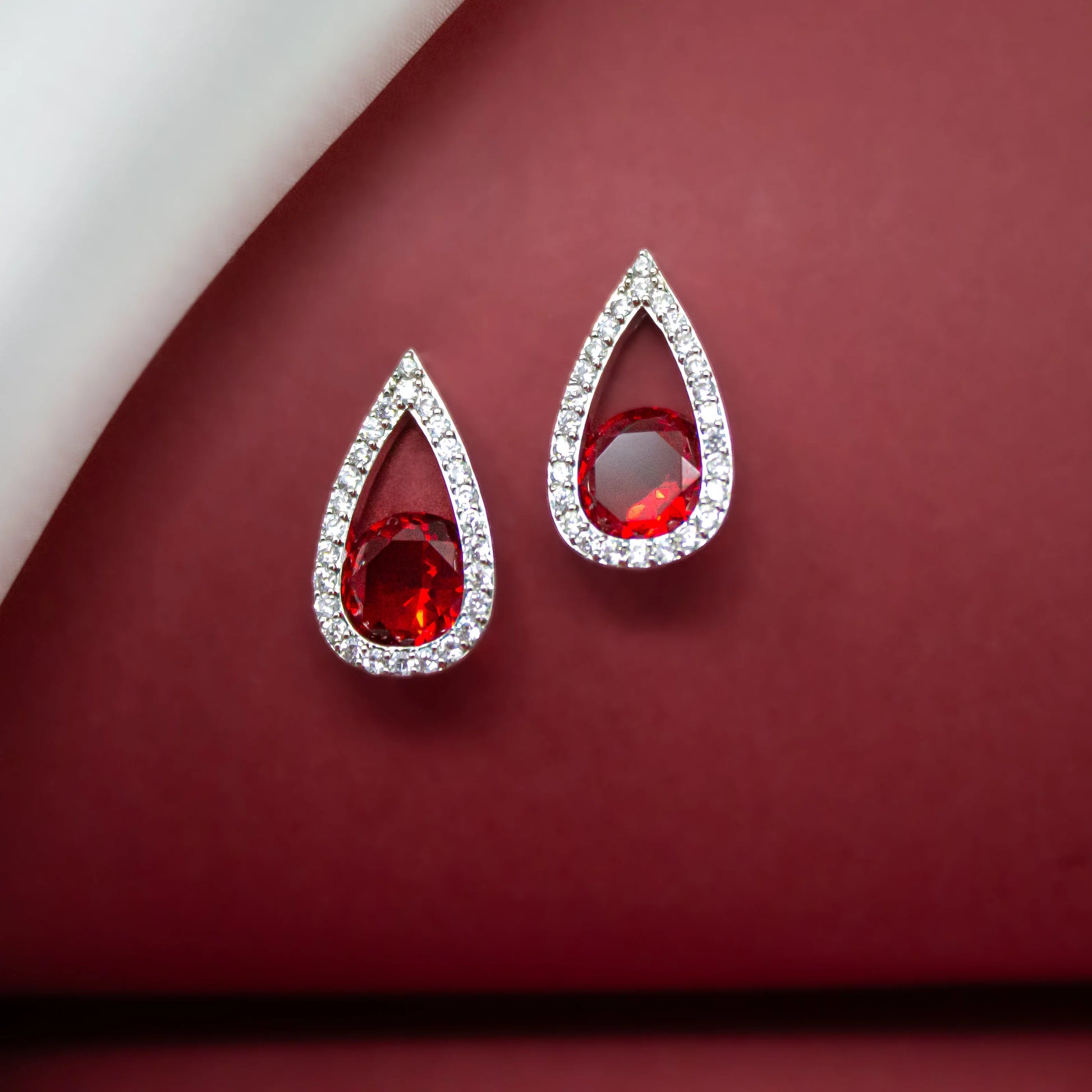 Red Dazzles Stud Earrings - Amulya Gems