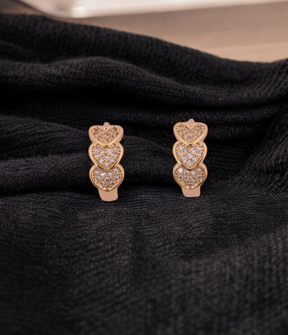 Elegant Gold-Tone Triple Heart Stud Earrings with Crystal Detailing